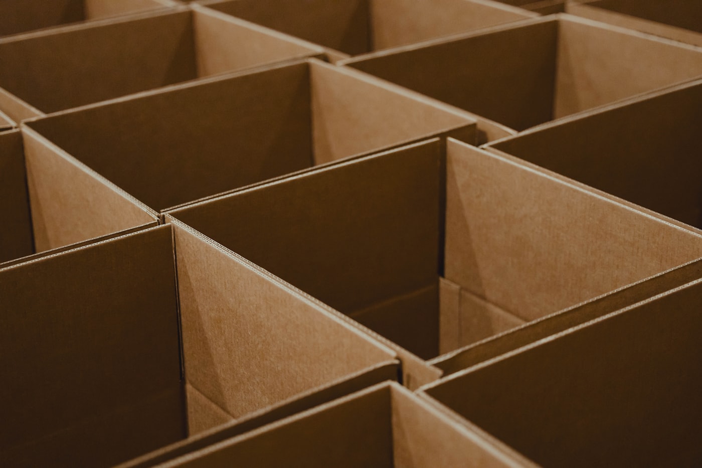 Rows of empty kraft corrugated boxes ready for packing