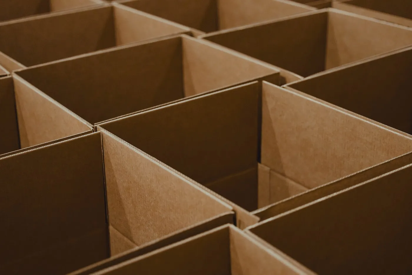 Rows of empty kraft corrugated boxes ready for packing
