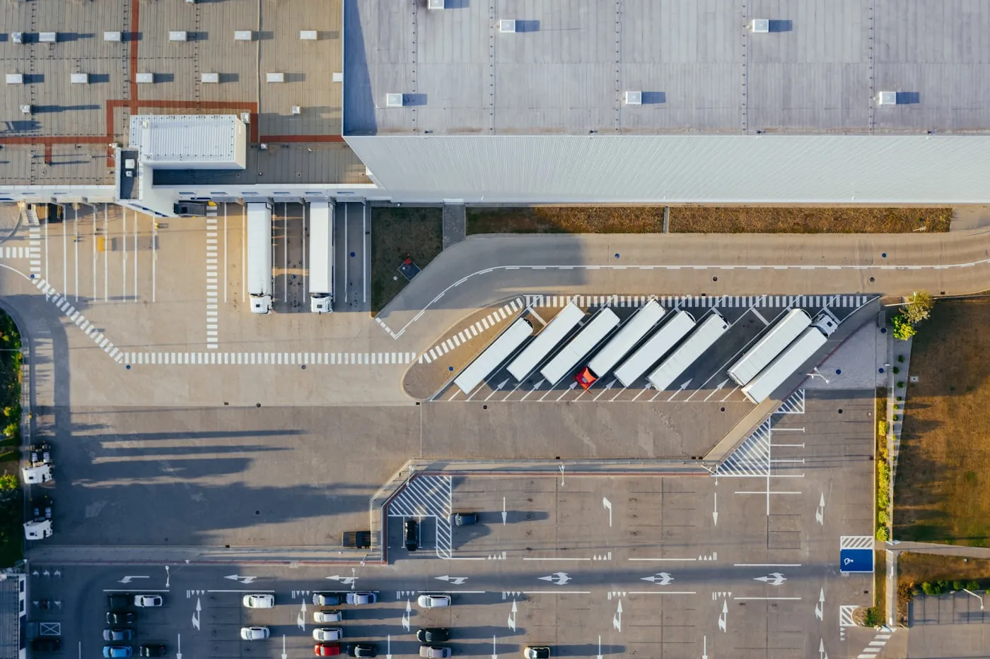 Aerial view of a distribution centre with trucks at the loading docks